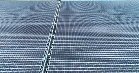 Aerial top view of solar panels or solar cells on buoy floating in lake sea Stock Footage 170656242