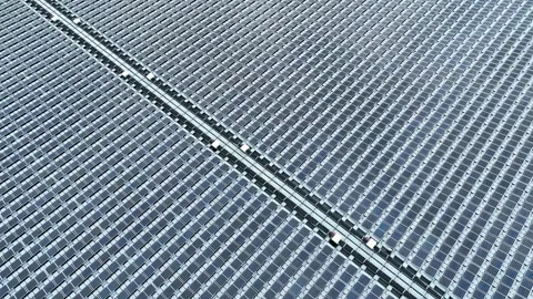Aerial top view of solar panels or solar cells on buoy floating in lake sea Stock Footage 170656318