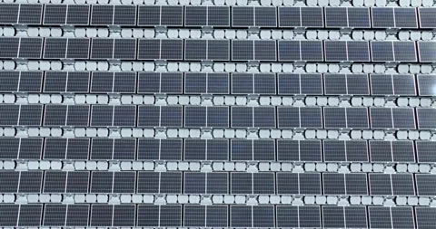 Aerial top view of solar panels or solar cells on buoy floating in lake sea Stock Footage 170656331