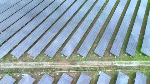 Aerial top view of solar panels or solar cells farm reflection with sunlight. Stock Footage 176055525
