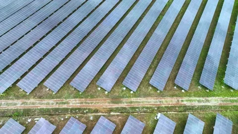 Aerial top view of solar panels or solar cells farm reflection with sunlight. Stock Footage 176055620