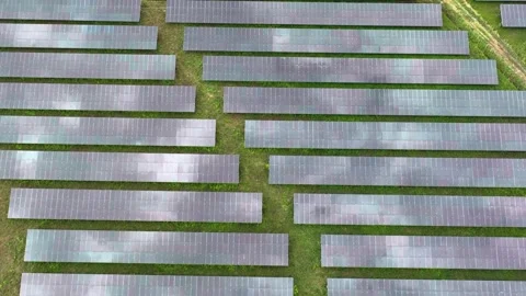 Aerial top view of solar panels or solar cells farm reflection with sunlight. Stock Footage 176055663