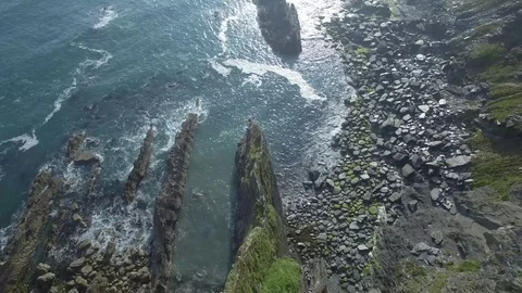 Aerial top of view of steep cliff during a sunny blue sky, Ireland Stock Footage 84271114
