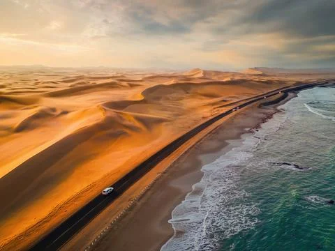 Aerial top view of street road with Namib Desert Safari, sand dune, coast s.. Stock Photos