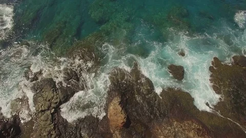 Aerial Top View Tilt Up Rocks To Reveal Ocean Stock Footage 74113236