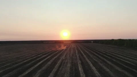 Aerial Top view, tractor plants spring wheat at sunset, sowing winter crops Stock Footage 158244769
