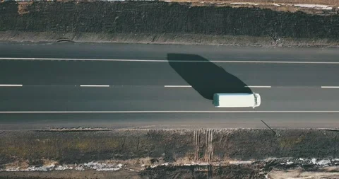 AERIAL. Top view to the truck's column driving on the road Stock Footage 145871577