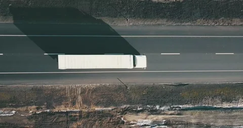 AERIAL. Top view to the truck's column driving on the road Stock Footage 145871603