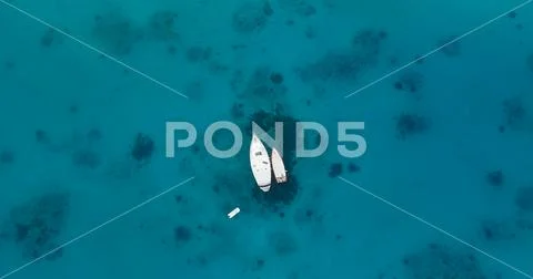 Aerial top view of two boats moored in the middle of the sea Stock Photos