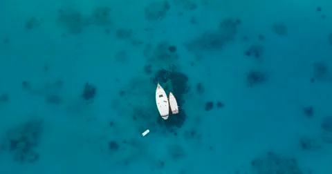 Aerial top view of two boats moored in the middle of the sea Stock Photos