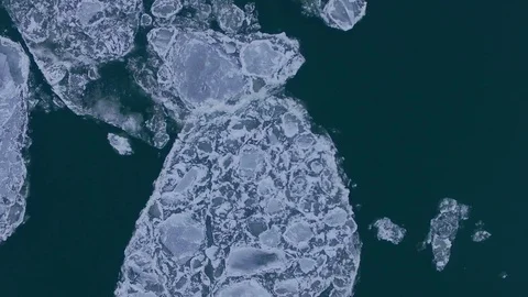 AERIAL: Top view of two colliding huge ice floes during ice drift. Stock Footage 83814864