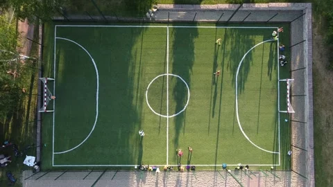 Aerial top view video shoot play on football field Stock Footage 201130422