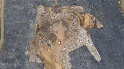Aerial top view video of a solid waste landfill. City waste treatment location Stock Footage 138187336