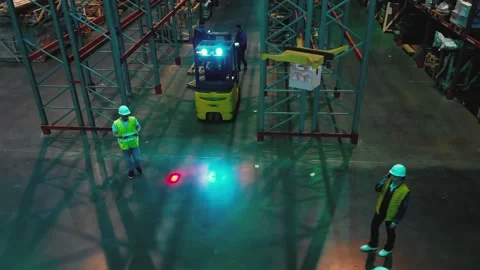 AERIAL. Top view of a warehouse zone. Worked controls a delivery drone. Stock Footage 149456569
