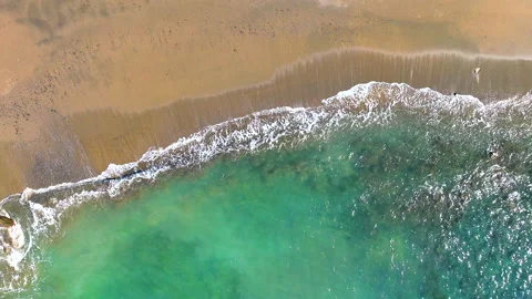 Aerial top view of waves on a beach Stock Footage 202198631