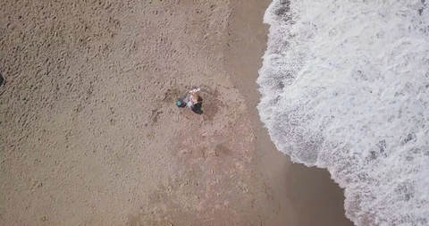 Aerial top view waves break on sand beach at sunset. Sea waves on the beautif Stock Footage 93278305