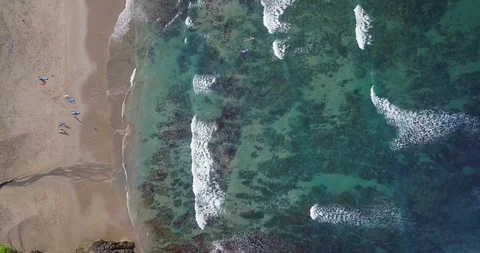 Aerial top view waves break on sand beach at sunset. Sea waves on the beautif Stock Footage 93280129