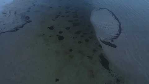 Aerial top view waves break at coast little isle at evening Stock Footage 104631918