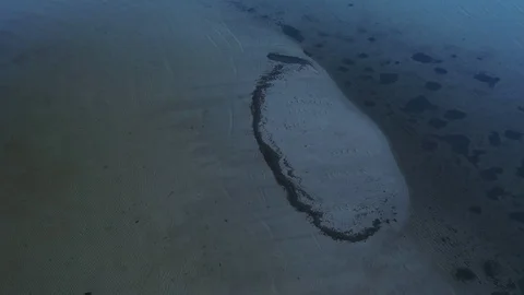Aerial top view waves break at coast little isle at evening Stock Footage 104632054