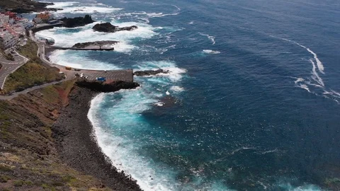 Aerial. Top view waves break on the coastline of Tenerife island Stock Footage 109185783