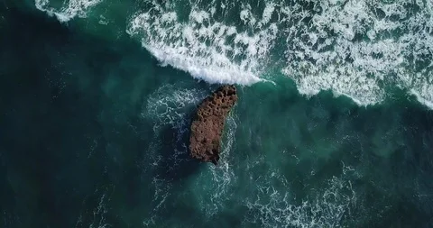 Aerial top view waves break on sand beach. Sea waves on beautiful beach aeria Video stock 111043789