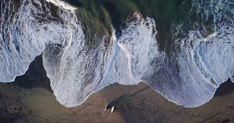 Aerial top view waves break on sand beach. Sea waves on beautiful beach aeria Stock Footage 111044164