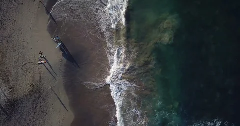 Aerial top view waves break on sand beach. Sea waves on beautiful beach aeria Stock Footage 111044683