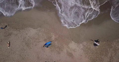 Aerial top view waves break on sand beach. Sea waves on beautiful beach aeria Stock Footage 111047300