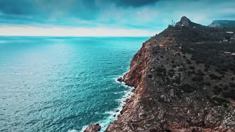 Aerial top view of waves break on rocks in a blue ocean. Sea waves on beautiful Stock Footage 149311105