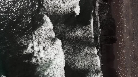 Aerial top view waves break on beach. . Bird's eye view of ocean waves crashing Video stock 151503479