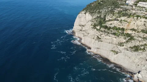 Aerial top view of waves break on rocks in a blue ocean. Sea waves on beautiful Stock Footage 177395025