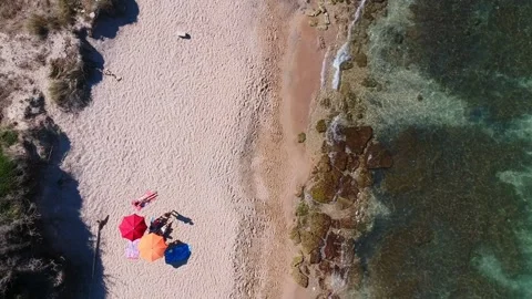 Aerial top view of the waves breaking on the beach of Torre Canne fraction of Stock-Footage 152092044