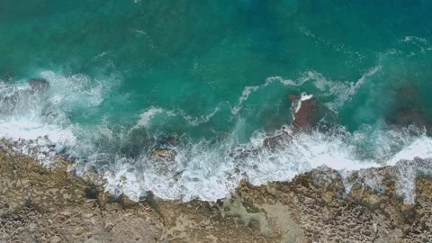 Aerial top view of the waves breaking on the rocks of Mola di Bari, Apulia. B Stock Footage 152092135