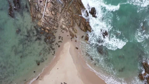 .Aerial top view The waves crashed into the straits of the beach. Video stock 157984923
