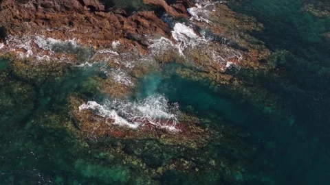 Aerial Top View Waves Crashing on Lava Rocks, Tenerife, Canary Islands Stock Footage 336317528