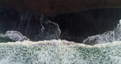 Aerial Top View of Waves Creating Foam Patterns on Sand Video stock 332150565