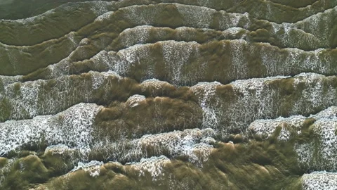 Aerial top view of the waves on the surface of muddy green water. Dirty sea Stock Footage 237768616
