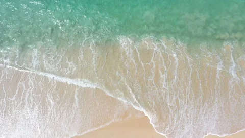 Aerial top view white wave swept on the white sand beach. Stock Footage 170780834