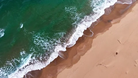 Aerial top view of a wild empty beach and turquoise sea waves Stock Footage 320553002