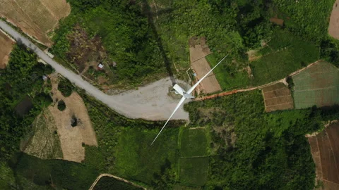 Aerial top view of windmills rotating at highland. Bird’s eye view shot Video stock 202221077