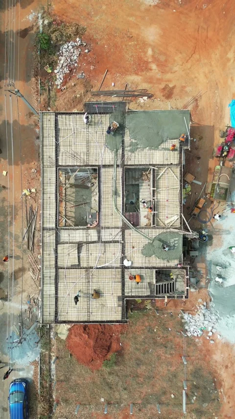 Aerial top view of workers pouring concrete on building roof slab Video stock 343882356