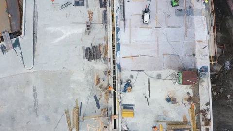 Aerial top view of workers working on the bridge under construction Stock Footage 125876231