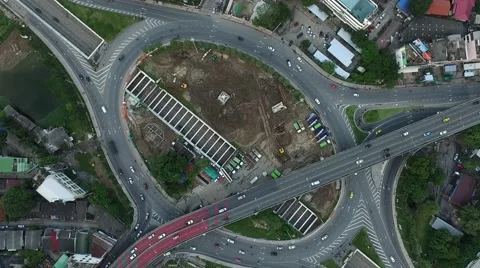 Aerial top view zoom out over the roundabout traffic with car moving Stock Footage 68356197