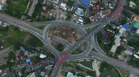 Aerial top view zoom in over the roundabout traffic with car moving Stock Footage 68356372