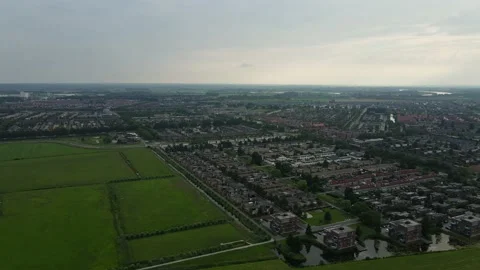 Aerial top view of Zwolle, surrounded by houses, green trees and canal Stock Footage 168701853