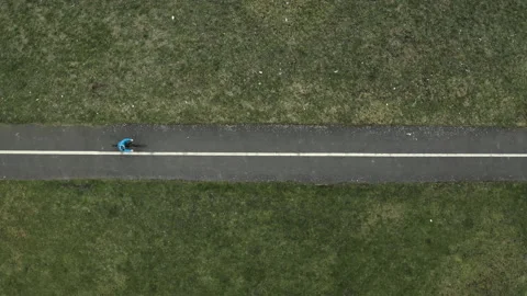 Aerial topdown still of cyclist going by - drone over bike UK NCL 0267 A GR Stock Footage 143300425