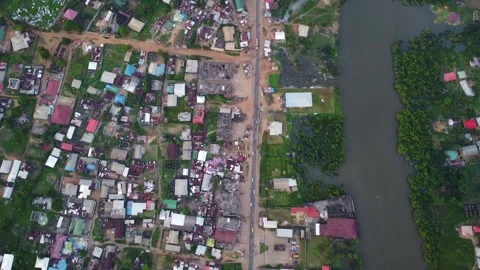 Aerial topdown view of a town with a river and dense housing arrangement Vídeos de archivo 318531373