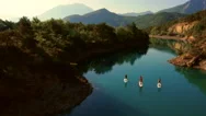 Aerial Of Tourists Paddle Boarding In River Stock Footage