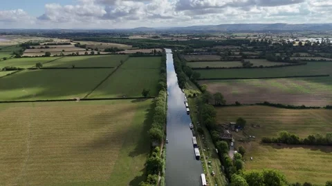 Aerial toward Gloucester from the Gloucester and Sharpness Canal, UK Stock Footage 313481492