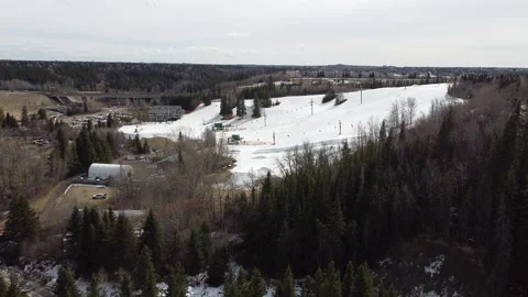 Aerial Towards Urban Ski Hill Stock Footage